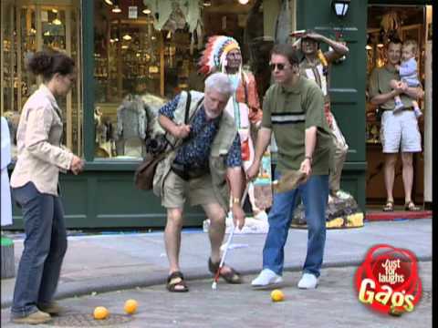 Blind man kicking oranges