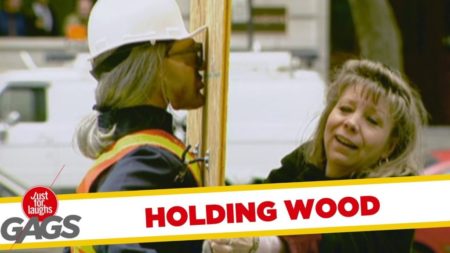 Holding the wood sheet prank