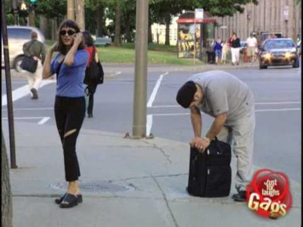 Suitcase bolted to sidewalk