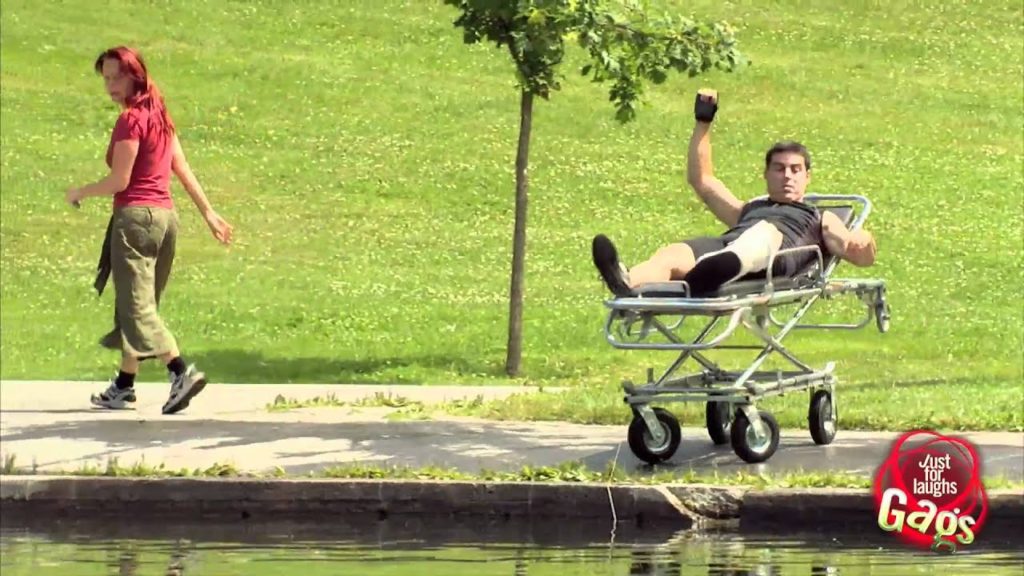 Man On Stretcher Rolls Into Lake