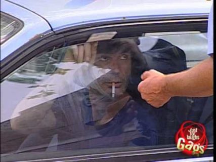 Policeman throwing food on car gag